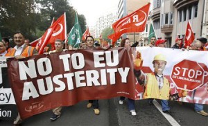 European workers and trade union representatives take part in protest to demand better job protection in Brussels