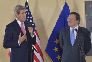 John Kerry, on the left, holding a microphone, and José Manuel Barroso