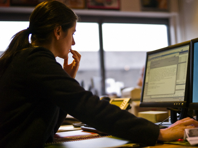 Woman Reading Email --- Image by © Helen King/Corbis