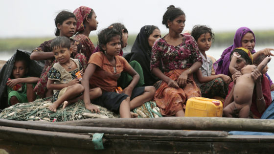 Rohingya refugees from Myanmar sit on a boat as they try to get into Bangladesh in Teknaf June 13, 2012. The UN Refugee Office (UNHCR) has called on Bangladesh to keep its borders open given the rapid escalation of violence in the northern Rakhine State of Myanmar, UN spokesman Martin Nesirky told reporters on Tuesday. REUTERS/Andrew Biraj (BANGLADESH - Tags: SOCIETY IMMIGRATION CIVIL UNREST) TEMPLATE OUT