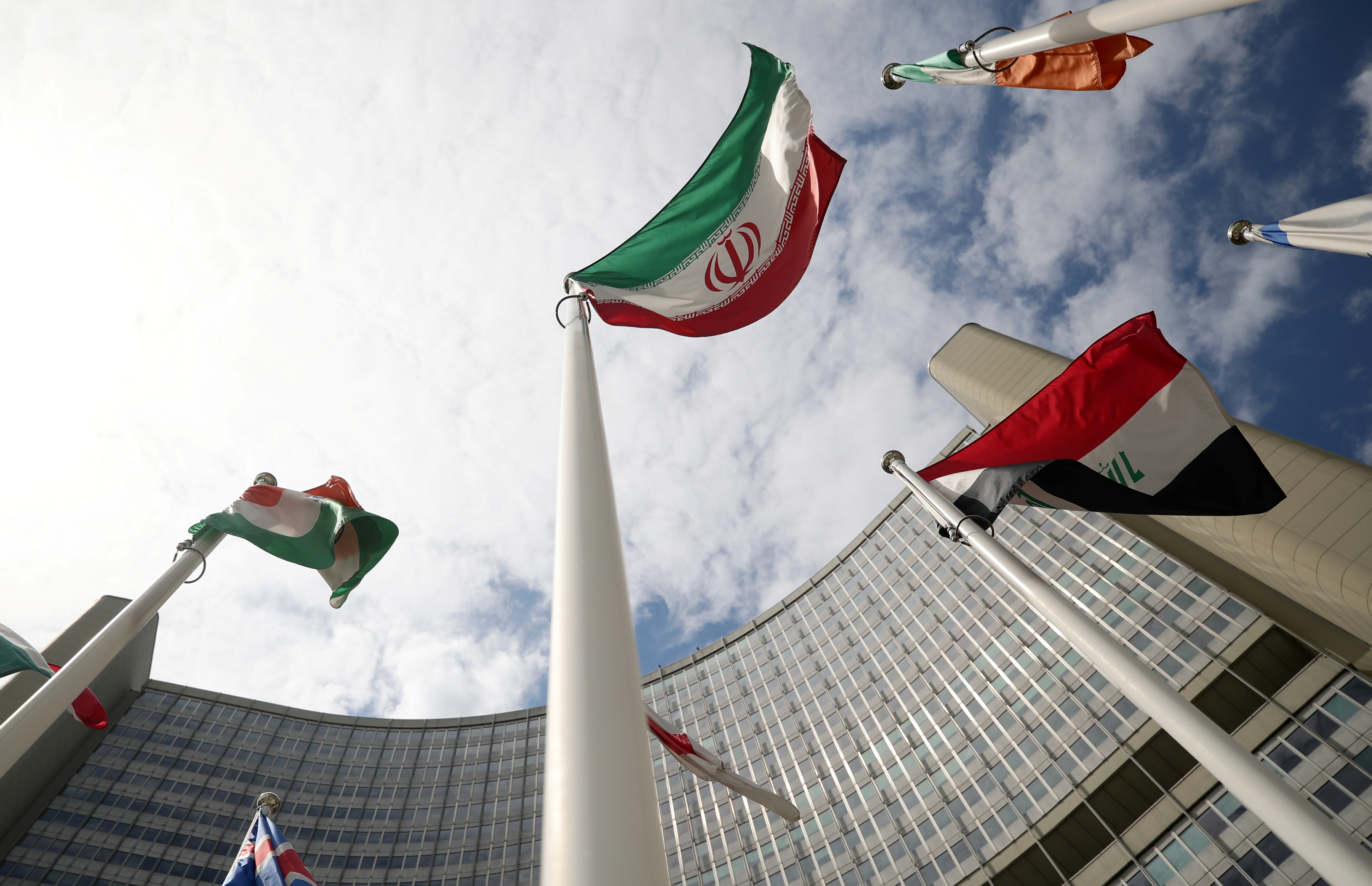 The Iranian flag flutters in front the International Atomic Energy Agency (IAEA) headquarters in Vienna, Austria July 10, 2019.  REUTERS/Lisi Niesner