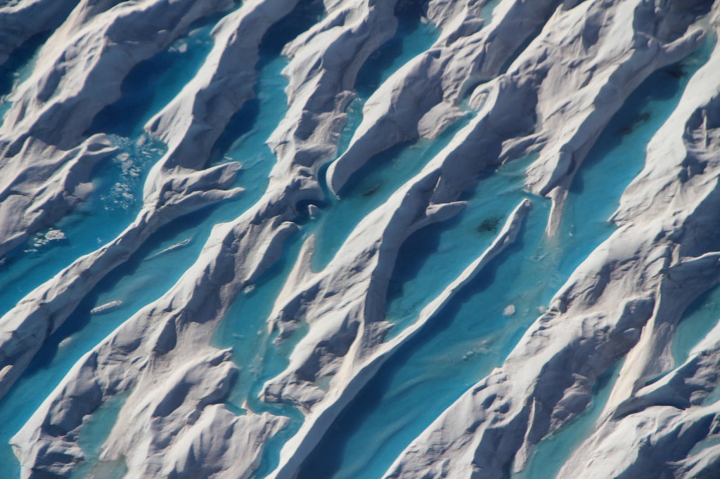 "Meltwater in crevasses in Greenland" by NASA's Marshall Space Flight Center is licensed under CC BY-NC 2.0