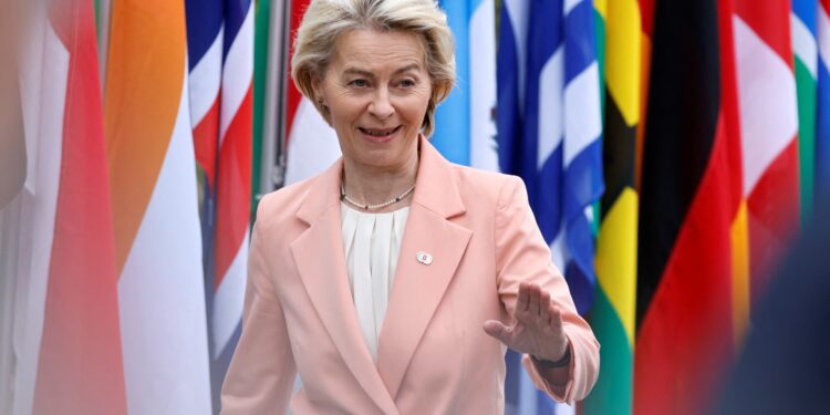 European Commission President Ursula von der Leyen waves as she arrives to take part in a Summit on Peace in Ukraine at the luxury Burgenstock resort, near Lucerne in central Switzerland, on June 15, 2024.  (Photo by Ludovic MARIN / AFP)