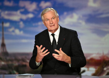 French Prime Minister Michel Barnier speaks during the evening news broadcast of French TV channel France 2 at the France Televisions studios in Paris, on September 22, 2024. (Photo by Julie SEBADELHA / POOL / AFP)