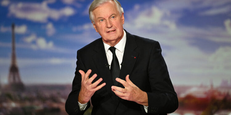 French Prime Minister Michel Barnier speaks during the evening news broadcast of French TV channel France 2 at the France Televisions studios in Paris, on September 22, 2024. (Photo by Julie SEBADELHA / POOL / AFP)